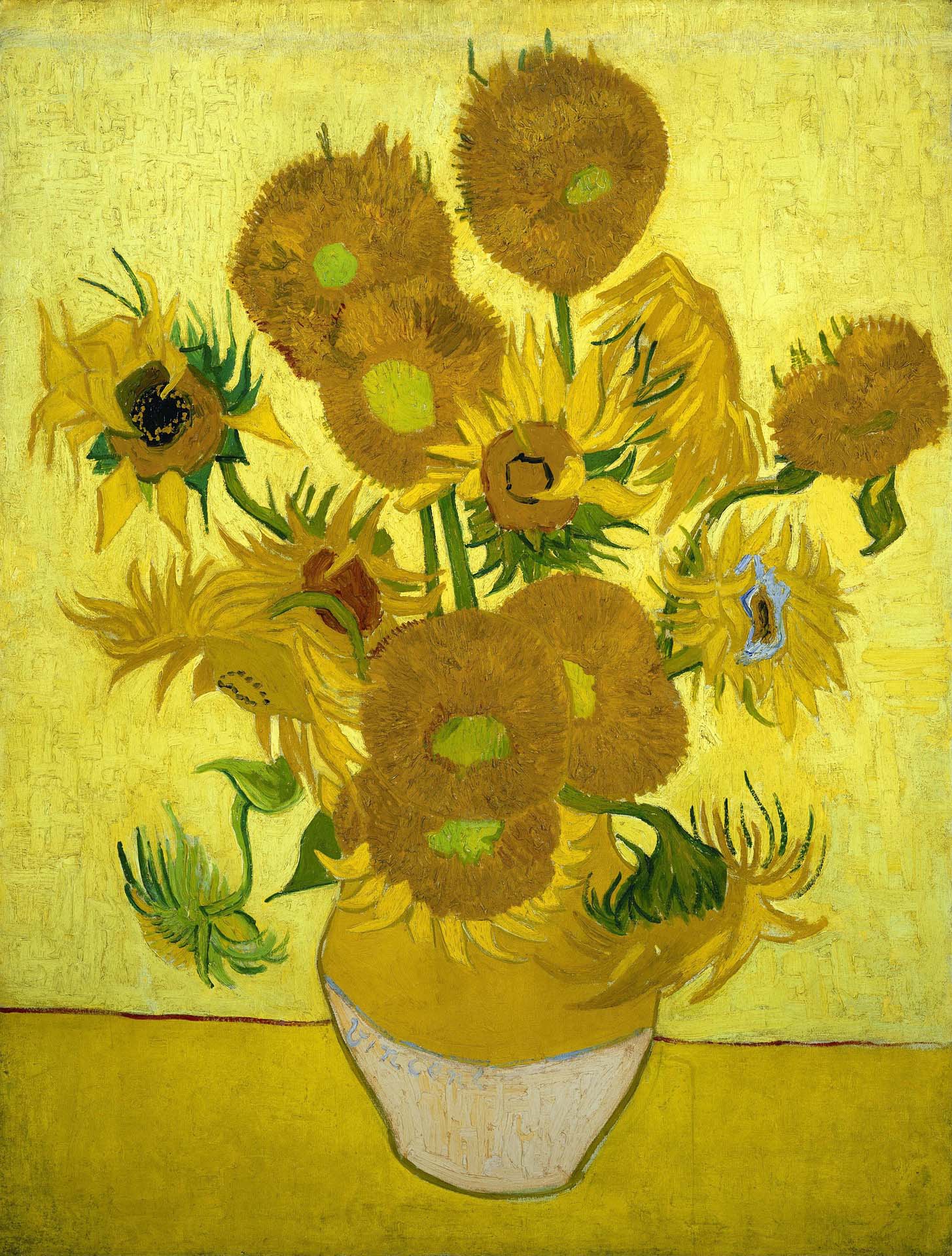 Van Gogh painting of various sunflowers in a vase.